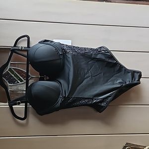 Swimsuits For All One Piece Swimsuit with lace insets.